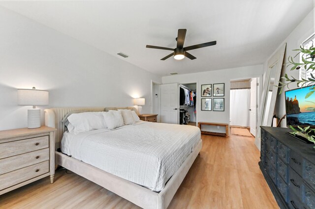 6214 Garrett St, Jupiter, FL 33458 - bedroom featuring visible vents, a ceiling fan, light wood-style flooring, and a spacious closet