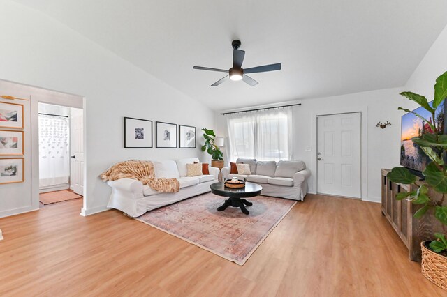 6214 Garrett St, Jupiter, FL 33458 - living room with light wood-style floors, a ceiling fan, baseboards, and lofted ceiling