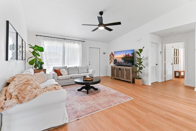 6214 Garrett St, Jupiter, FL 33458 - living area with baseboards, ceiling fan, wood finished floors, and lofted ceiling