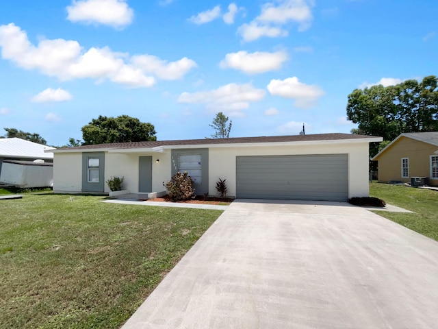 1541 SW Curry St, Port Saint Lucie, FL 34983 - ranch-style house with stucco siding, concrete driveway, a garage, and a front yard