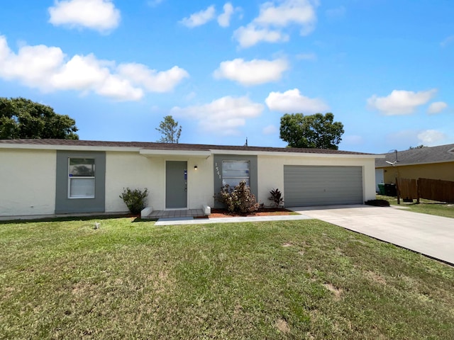 1541 SW Curry St, Port Saint Lucie, FL 34983 - single story home featuring stucco siding, driveway, a garage, and a front yard