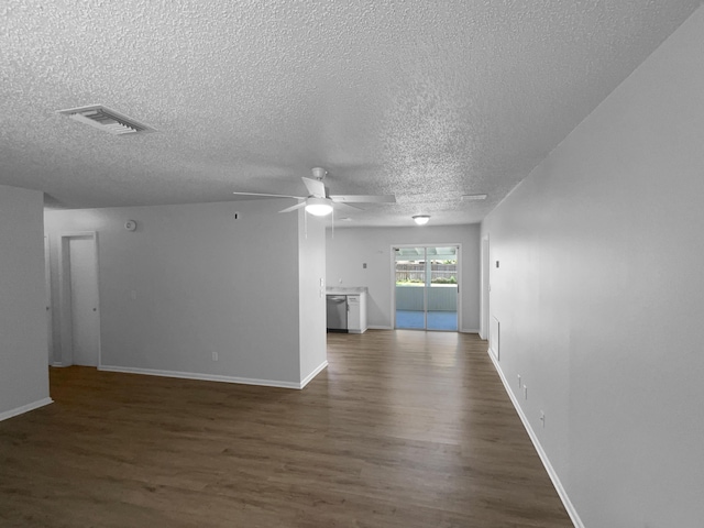 1541 SW Curry St, Port Saint Lucie, FL 34983 - unfurnished living room with dark wood-type flooring, ceiling fan, and a textured ceiling