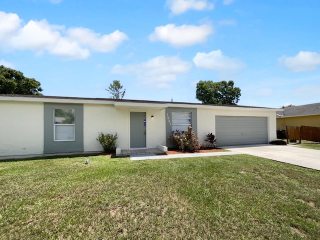 1541 SW Curry St, Port Saint Lucie, FL 34983 - view of front of home featuring stucco siding, driveway, and an attached garage