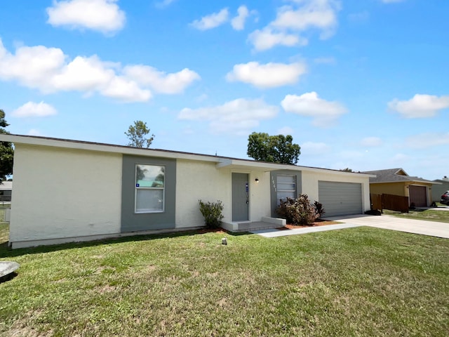 1541 SW Curry St, Port Saint Lucie, FL 34983 - view of front of home with concrete driveway, stucco siding, a garage, and a front yard