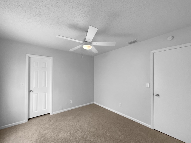 1541 SW Curry St, Port Saint Lucie, FL 34983 - unfurnished bedroom with carpet, a ceiling fan, and a textured ceiling
