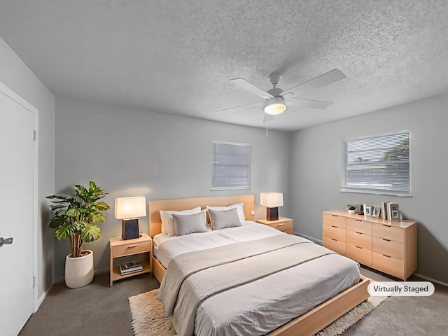 1541 SW Curry St, Port Saint Lucie, FL 34983 - bedroom with carpet floors, a ceiling fan, and a textured ceiling