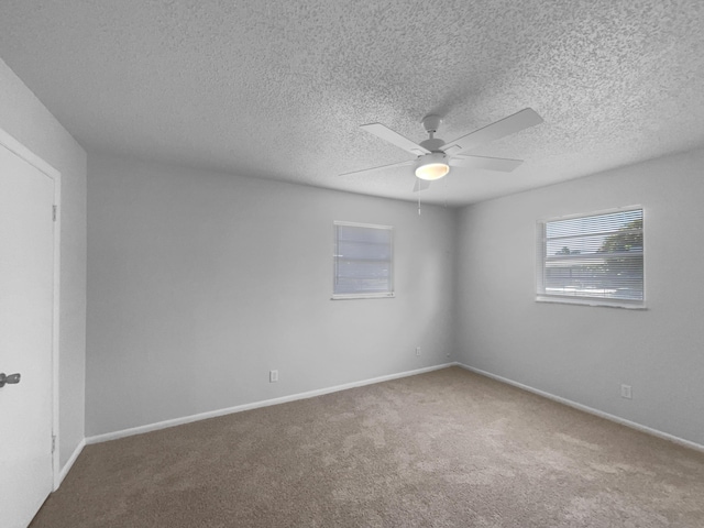 1541 SW Curry St, Port Saint Lucie, FL 34983 - carpeted empty room with ceiling fan and a textured ceiling