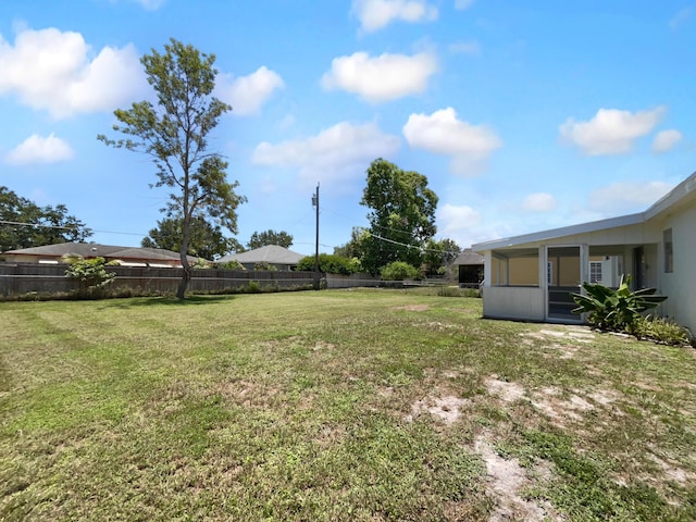 1541 SW Curry St, Port Saint Lucie, FL 34983 - view of yard with a sunroom