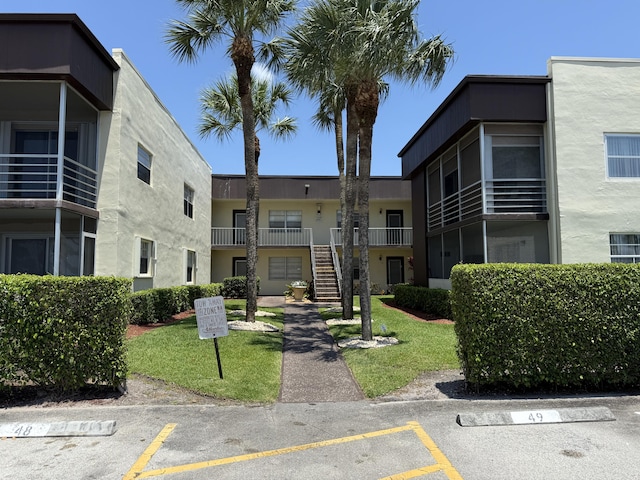 view of property's community featuring uncovered parking