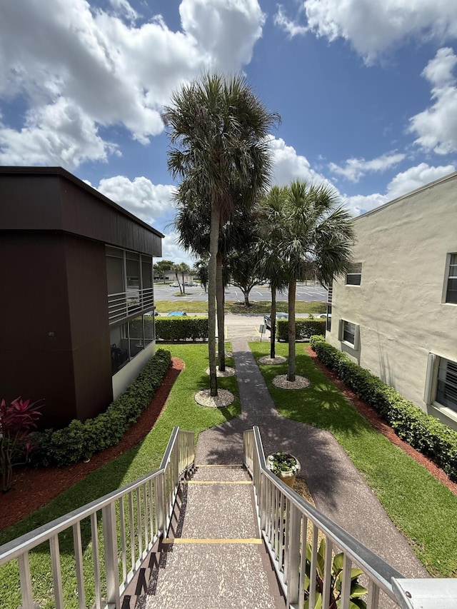 view of home's community featuring a yard