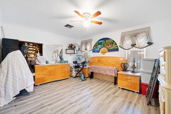 6531 SE Federal Hwy SE Unit Q108, Stuart, FL 34997 - bedroom featuring light wood-style floors, visible vents, and a ceiling fan