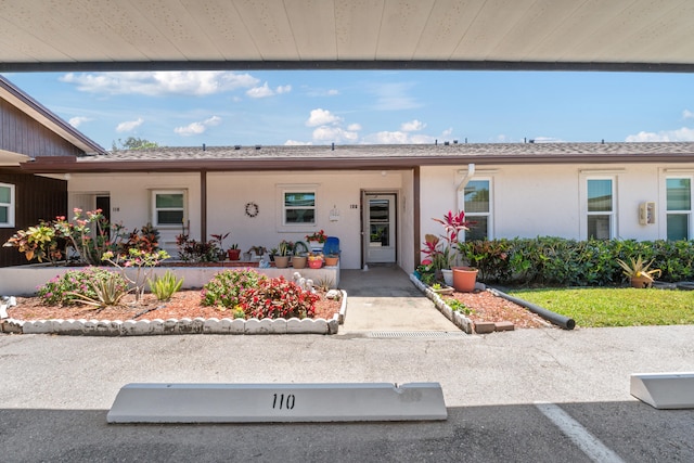 6531 SE Federal Hwy SE Unit Q108, Stuart, FL 34997 - view of front of property featuring covered porch and stucco siding