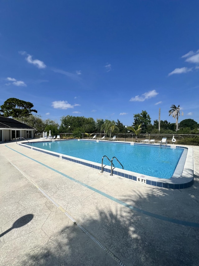 207 SW Bridgeport Dr, Port Saint Lucie, FL 34953 - pool with a patio area and fence