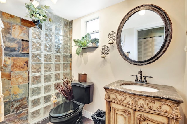 2669 S Garden Dr S Unit 401, Lake Worth, FL 33461 - full bathroom featuring vanity, a walk in shower, toilet, and baseboards