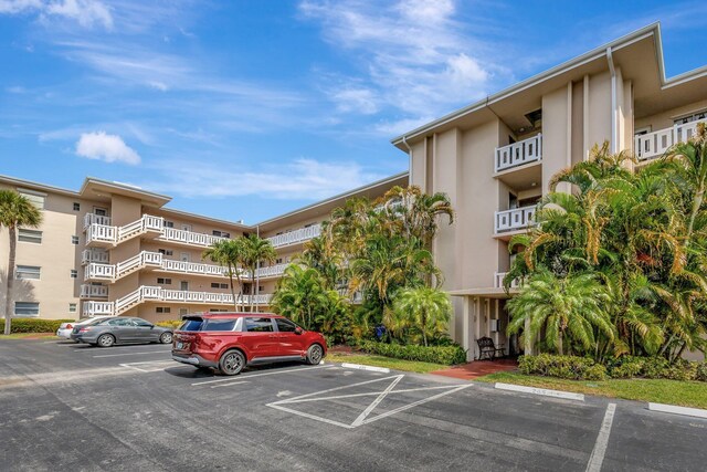 2669 S Garden Dr S Unit 401, Lake Worth, FL 33461 - view of apartment building / complex featuring uncovered parking