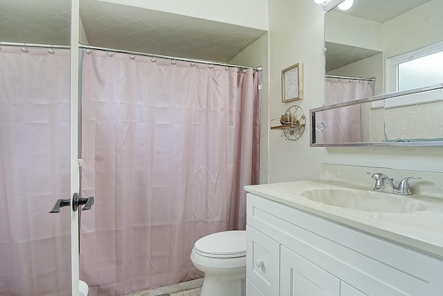 full bathroom featuring vanity and toilet