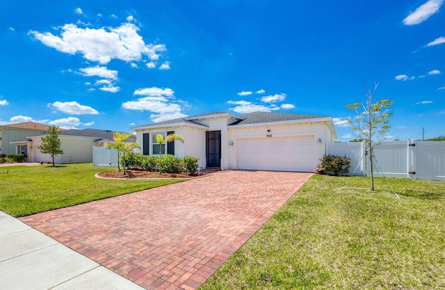 7568 NW Deysbrook Ln, Port Saint Lucie, FL 34987 - ranch-style home with a gate, fence, decorative driveway, a front lawn, and an attached garage