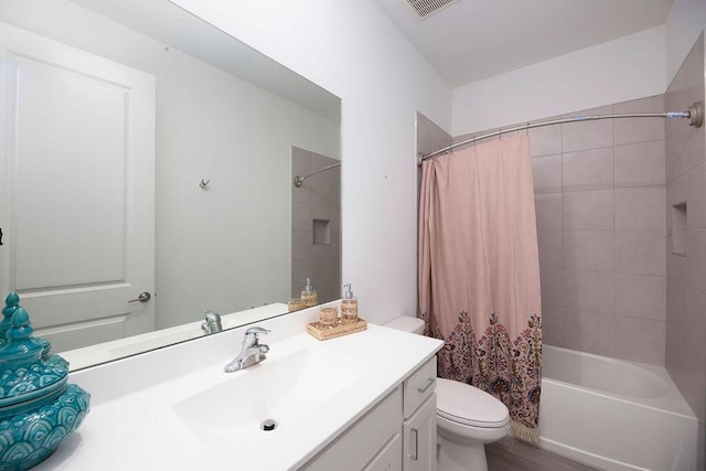 7568 NW Deysbrook Ln, Port Saint Lucie, FL 34987 - bathroom featuring visible vents, shower / tub combo with curtain, toilet, and vanity