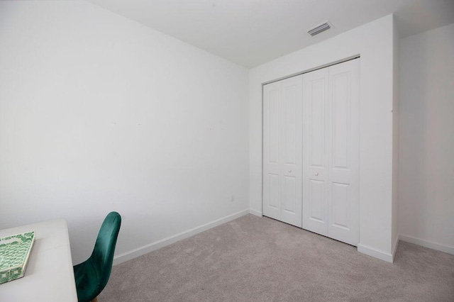 7568 NW Deysbrook Ln, Port Saint Lucie, FL 34987 - unfurnished office with baseboards, visible vents, and carpet floors