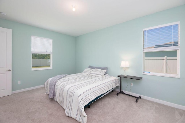 7568 NW Deysbrook Ln, Port Saint Lucie, FL 34987 - carpeted bedroom featuring baseboards