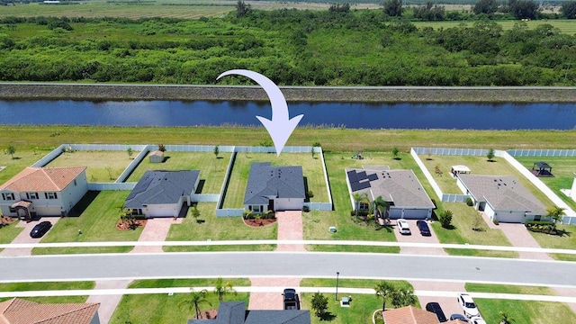 7568 NW Deysbrook Ln, Port Saint Lucie, FL 34987 - aerial view with a water view and a residential view