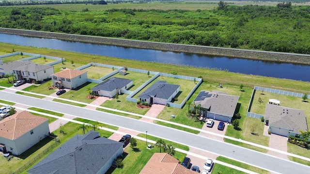 7568 NW Deysbrook Ln, Port Saint Lucie, FL 34987 - drone / aerial view with a residential view and a water view