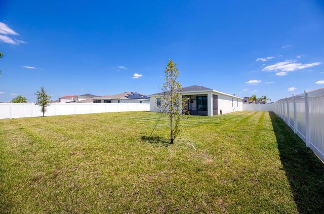 7568 NW Deysbrook Ln, Port Saint Lucie, FL 34987 - view of yard featuring a fenced backyard