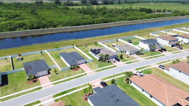7568 NW Deysbrook Ln, Port Saint Lucie, FL 34987 - birds eye view of property featuring a residential view and a water view