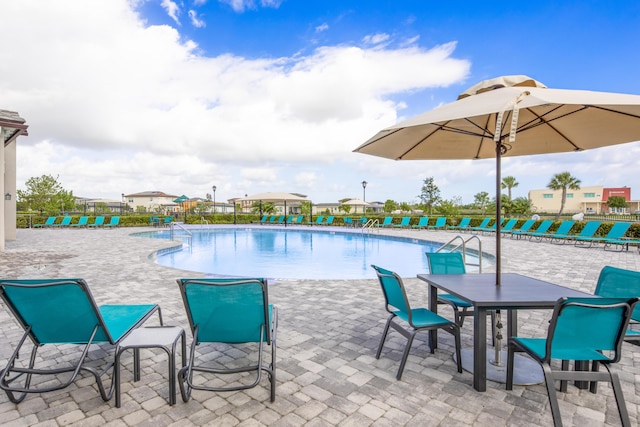 7568 NW Deysbrook Ln, Port Saint Lucie, FL 34987 - pool with fence and a patio