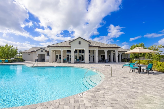 7568 NW Deysbrook Ln, Port Saint Lucie, FL 34987 - pool with a patio and fence