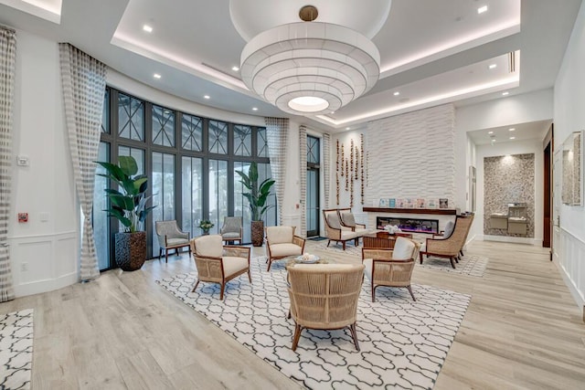 12408 Banner Ct, Palm Beach Gardens, FL 33412 - lobby featuring a towering ceiling, recessed lighting, a decorative wall, and a wainscoted wall