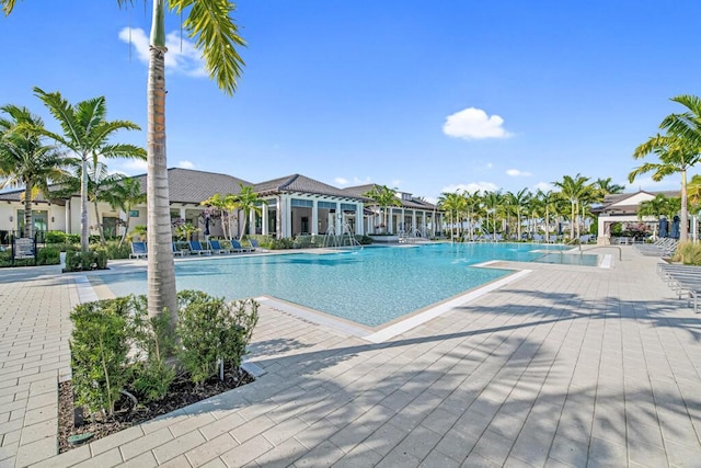 12408 Banner Ct, Palm Beach Gardens, FL 33412 - community pool featuring a patio area