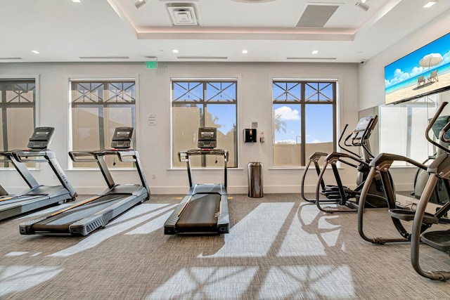 12408 Banner Ct, Palm Beach Gardens, FL 33412 - exercise room with a tray ceiling, carpet flooring, recessed lighting, and baseboards