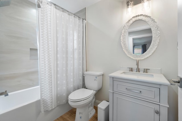 bathroom with shower / tub combo, wood finished floors, vanity, and toilet