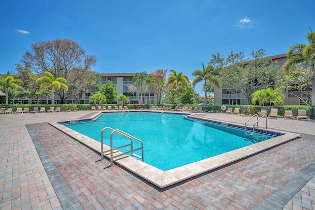 801 SW 133rd Ter Unit 317K, Pembroke Pines, FL 33027 - community pool featuring a patio area