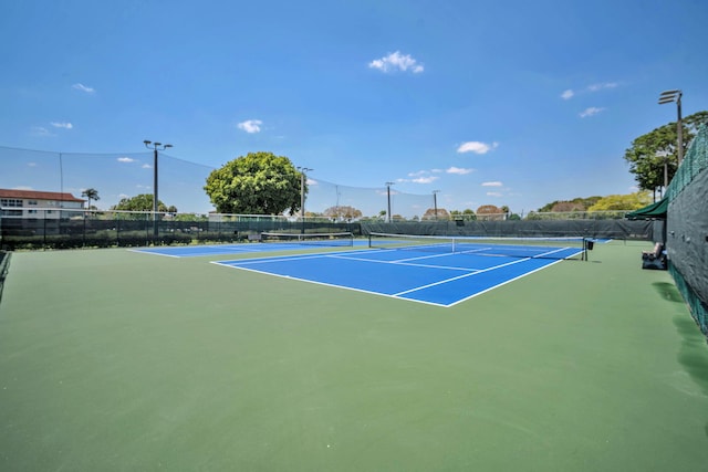 801 SW 133rd Ter Unit 317K, Pembroke Pines, FL 33027 - view of sport court featuring fence