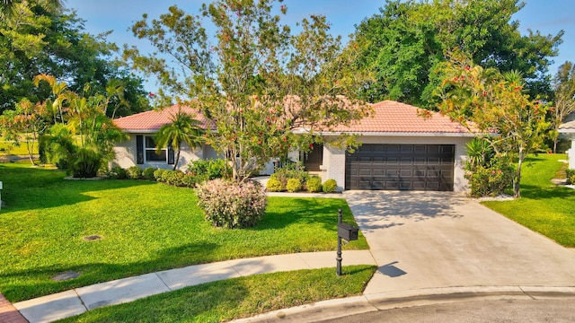 obstructed view of property with a tile roof, a garage, concrete driveway, and a front lawn