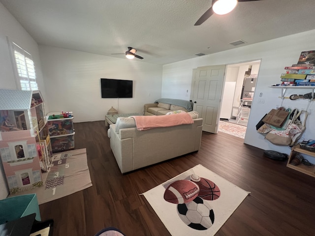 16629 74th Ave N, Palm Beach Gardens, FL 33418 - living room with visible vents, a textured ceiling, ceiling fan, and wood finished floors