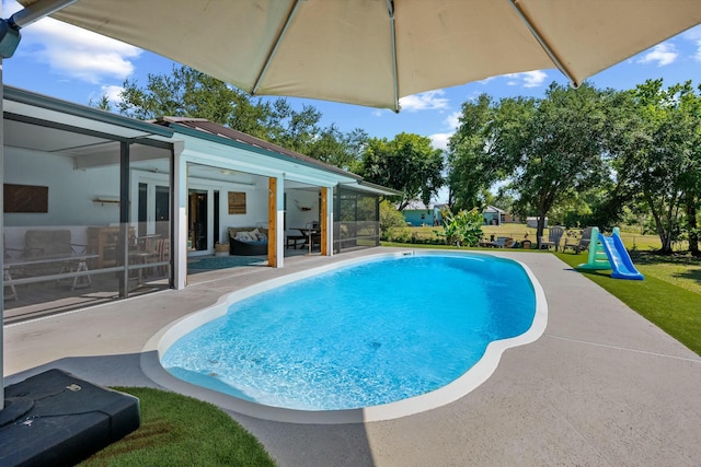 16629 74th Ave N, Palm Beach Gardens, FL 33418 - view of swimming pool featuring a fenced in pool, a patio, and a playground