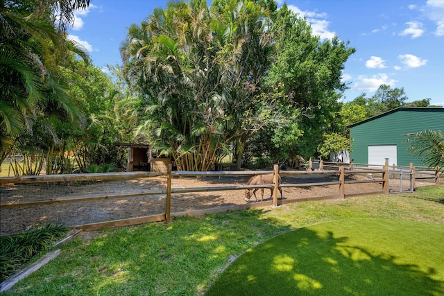 16629 74th Ave N, Palm Beach Gardens, FL 33418 - view of yard featuring a garage and fence