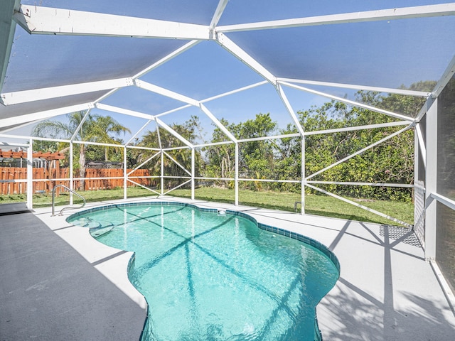 509 SW Feldman Ave, Port Saint Lucie, FL 34953 - view of pool featuring a patio and glass enclosure