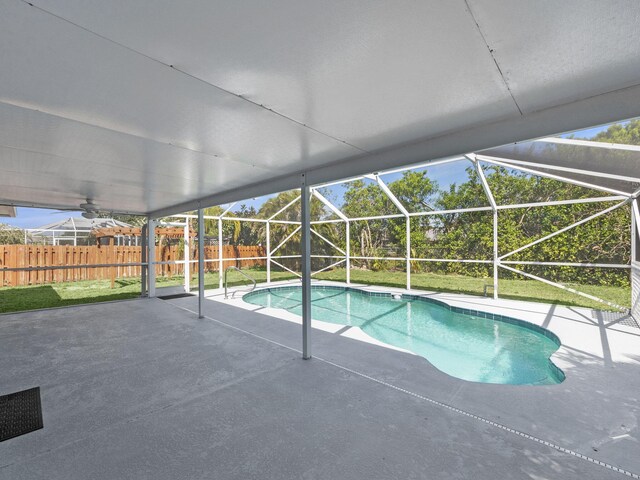 509 SW Feldman Ave, Port Saint Lucie, FL 34953 - view of pool featuring a patio area, a fenced backyard, and glass enclosure