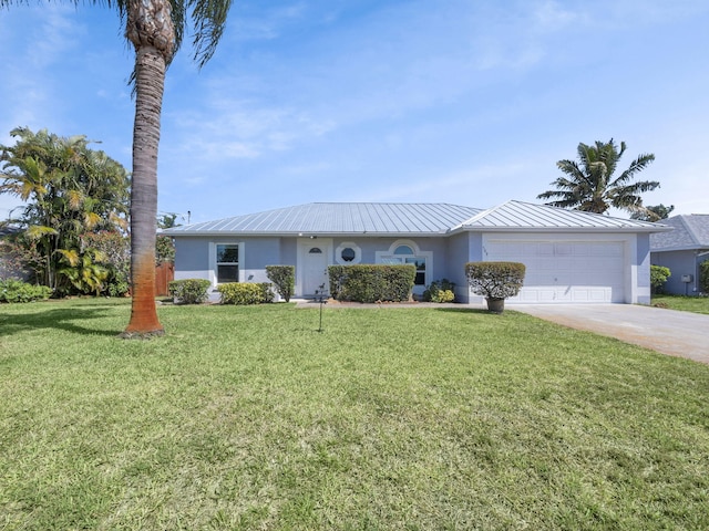 509 SW Feldman Ave, Port Saint Lucie, FL 34953 - single story home featuring stucco siding, an attached garage, concrete driveway, and metal roof