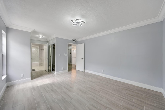 9305 Flynn Cir Unit 8, Boca Raton, FL 33496 - unfurnished bedroom with light wood-style flooring, ornamental molding, ensuite bath, and a textured ceiling