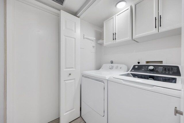 9305 Flynn Cir Unit 8, Boca Raton, FL 33496 - washroom featuring cabinet space and separate washer and dryer