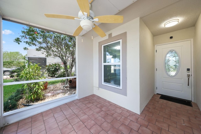 9305 Flynn Cir Unit 8, Boca Raton, FL 33496 - entrance foyer with a ceiling fan and brick patterned floors