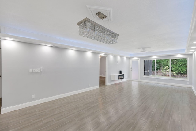 9305 Flynn Cir Unit 8, Boca Raton, FL 33496 - unfurnished living room featuring light wood-style floors and ceiling fan
