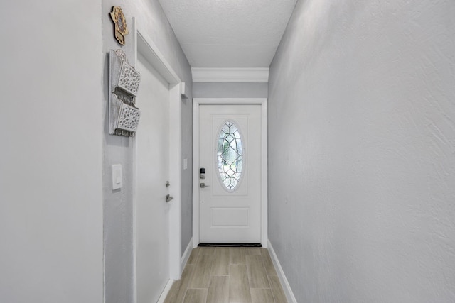 9305 Flynn Cir Unit 8, Boca Raton, FL 33496 - doorway with light wood-style floors and a textured ceiling