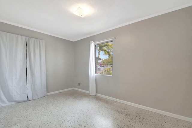 953 Churchill Rd, West Palm Beach, FL 33405 - spare room with speckled floor, ornamental molding, and baseboards
