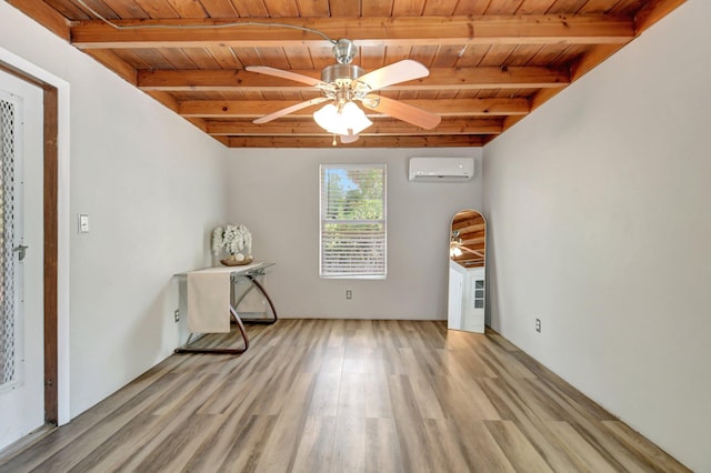 953 Churchill Rd, West Palm Beach, FL 33405 - spare room featuring a wall unit AC, wooden ceiling with exposed beams, ceiling fan, and light wood-style flooring